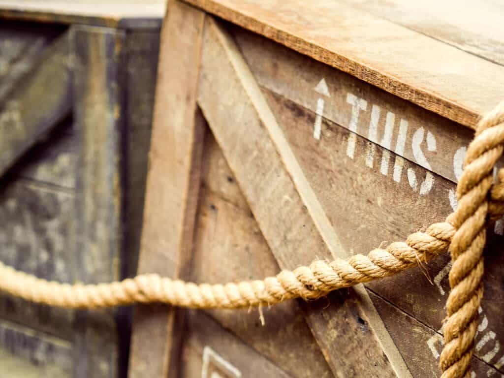 shipping wooden crate box with a rope and a signage