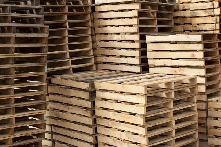wooden pallets stacked high